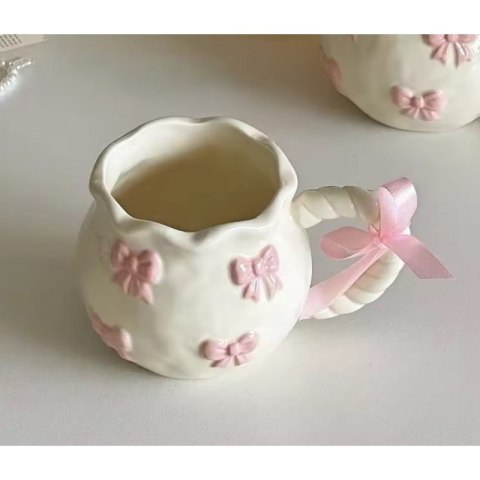 Kubek ceramiczny biały z różowymi kokardkami 300ml 1szt CUP24 Kubek ceramiczny biały z różowymi kokardkami 300ml 1szt CUP24